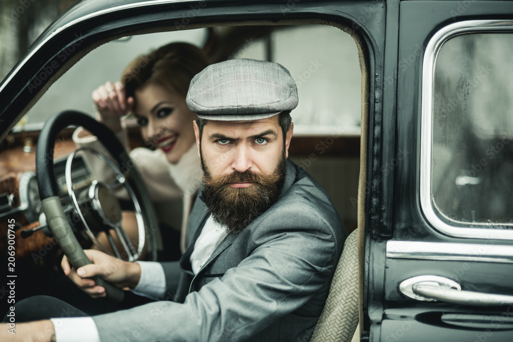 Bearded man and sexy woman in car. bearded man driver on date with sexy girl in retro car. Bearded man and sexy woman in car. bearded man driver on date with sexy girl in retro car.