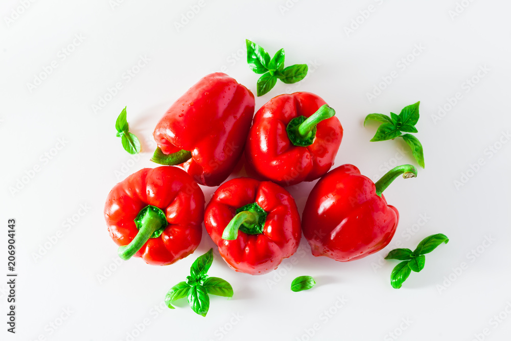 group of red ripe organic bell pepper and fresh basil leaves isolated on white group of red ripe organic bell pepper and fresh basil leaves isolated on white
