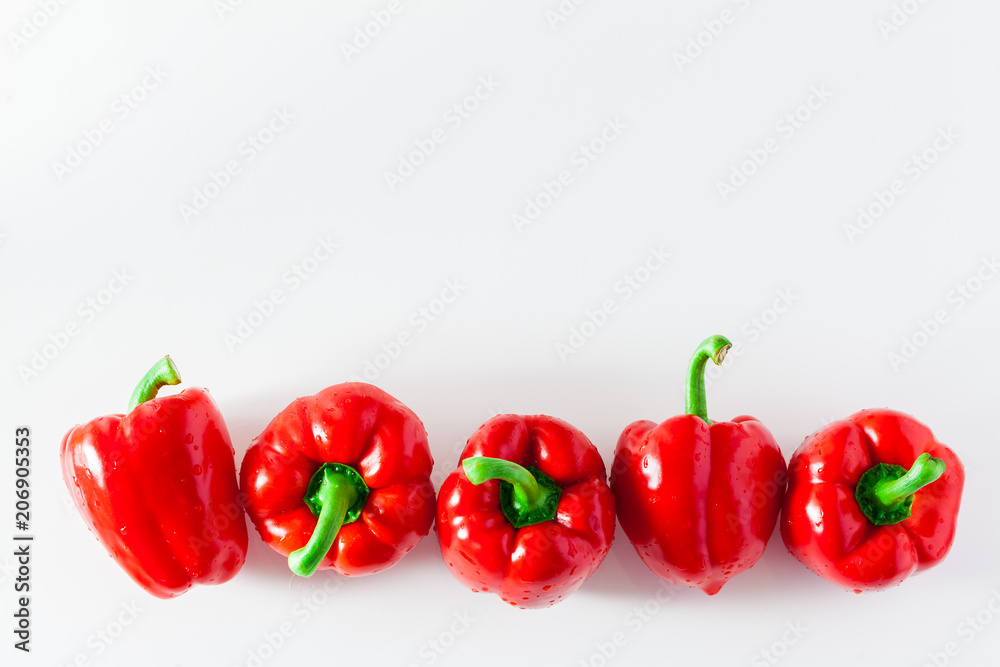 group of red ripe organic bell pepper  isolated on white. copy space