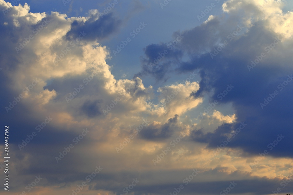 Cloud drama in front of blue sky