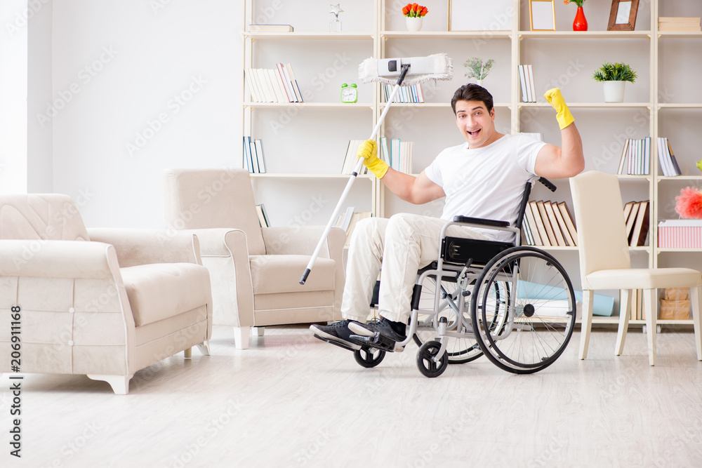 Disabled man cleaning floor at home Disabled man cleaning floor at home