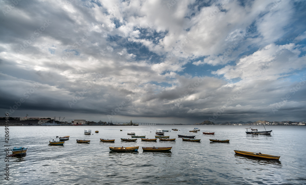 Fishing boats in dramatic landscape