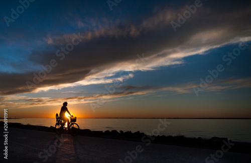 silhouette of biker in sunset
