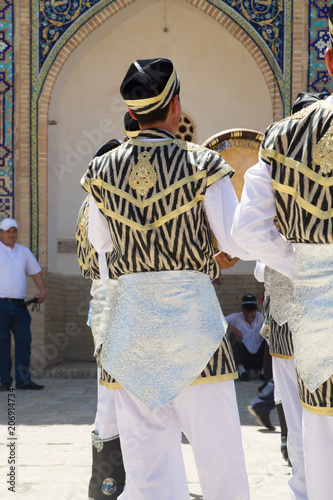 BUKHARA, UZBEKISTAN - MAY 25, 2018: Silk and Spices Festival 2018. Bukharian dancer girls in local dress dance, in Bukhara, Uzbekistan. photo