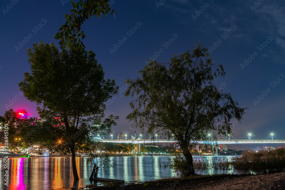 Panorama of night city with embankment of Rostov-on-Don