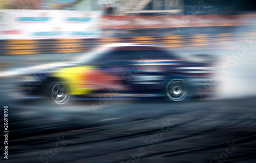 Drift racer,Race car racing on speed track with motion blur.