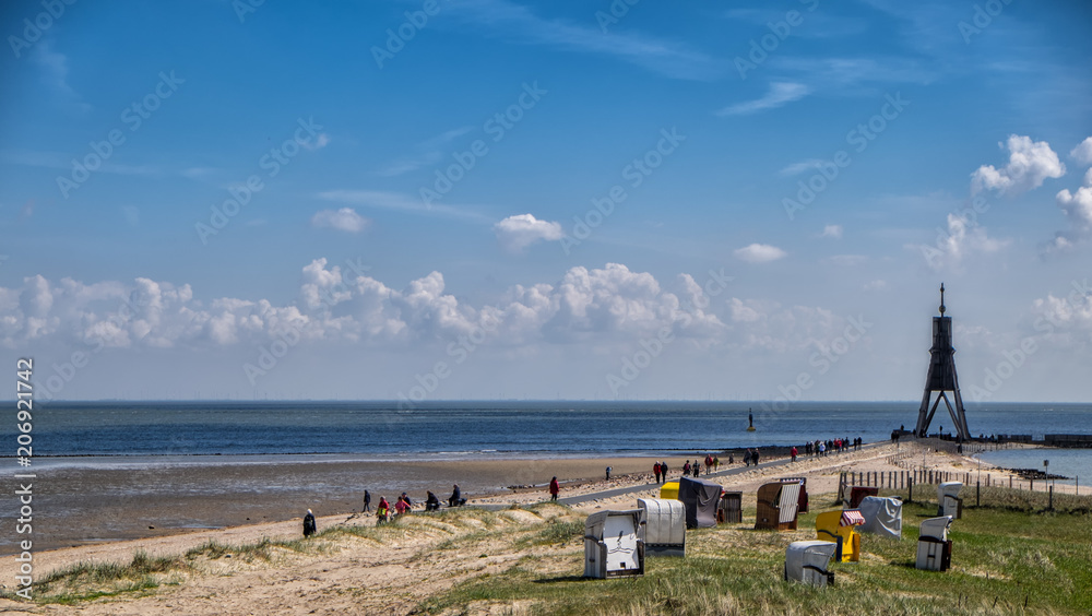 Sandy beach under vivid blue sky on a warm and sunny day in Cuxhaven