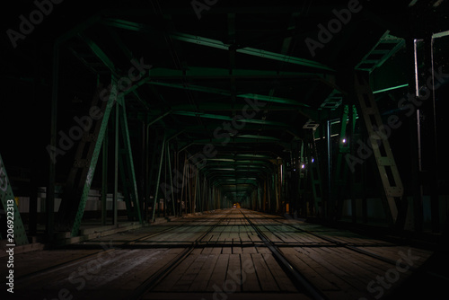 The tram tracks of Most Gdanski Bridge in Warsaw at night photo