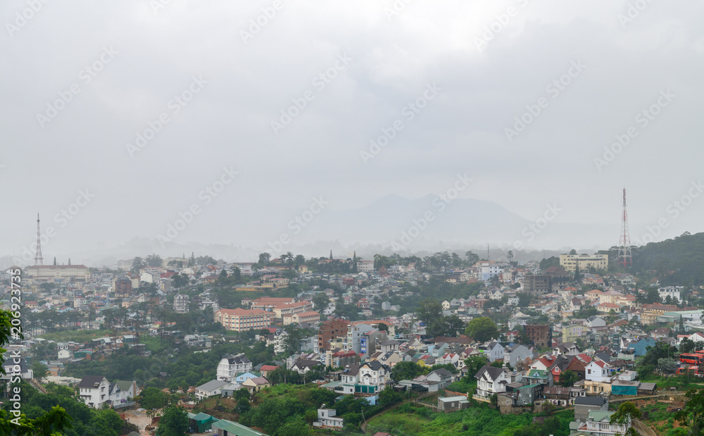 Cityscape of Da Lat, vietnam with fog in rainy
