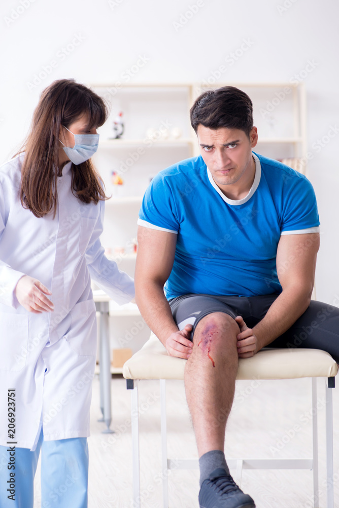 Fototapeta premium Patient visiting doctor after sustaining sports injury