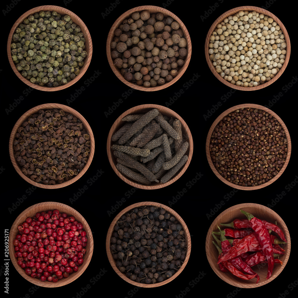 set of peppercorn in wooden cup isolated on black background