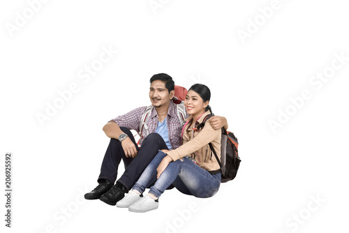 Images of asian couple tourist sitting and relaxing