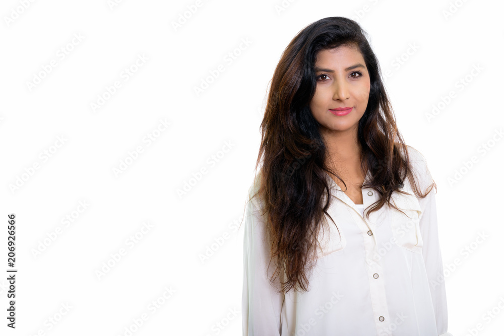 Studio shot of young beautiful Persian woman isolated against wh Studio shot of young beautiful Persian woman isolated against wh