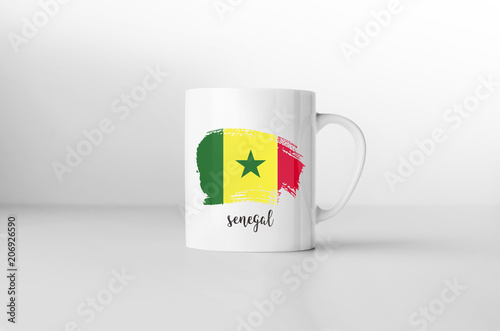 Senegal flag souvenir mug on white background. 3D rendering.