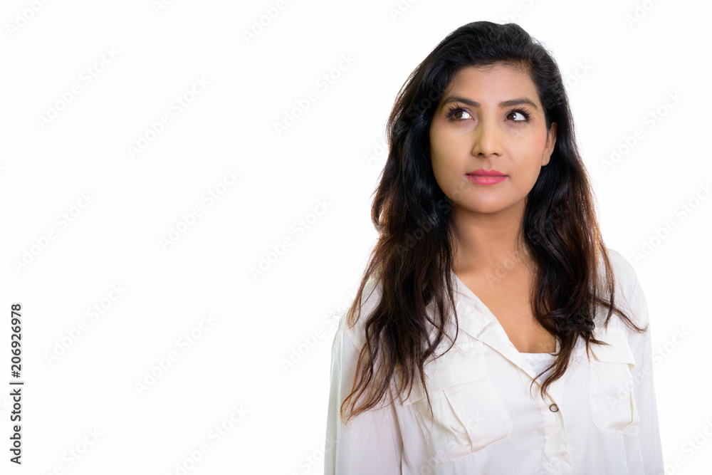 Studio shot of young beautiful Persian woman thinking isolated a Studio shot of young beautiful Persian woman thinking isolated a