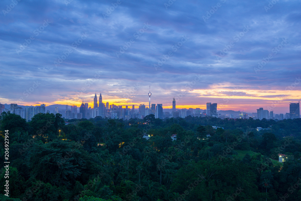 Majestic sunrise over KL Tower and surrounded buildings in downtown Kuala Lumpur, Malaysia.	