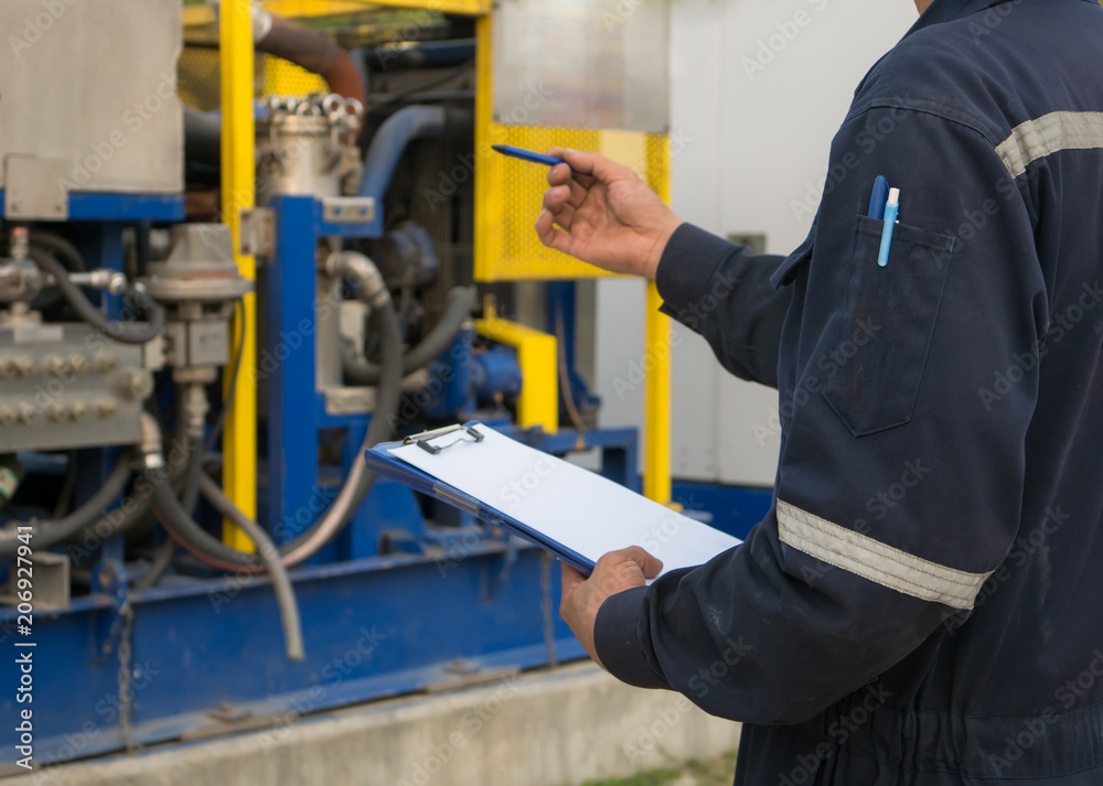 Worker engineer Man work in oil or gas refinery, turning on and off the pipeline valve torso and hand engineer yellow helmet . Worker engineer Man work in oil or gas refinery, turning on and off the pipeline valve torso and hand engineer yellow helmet .