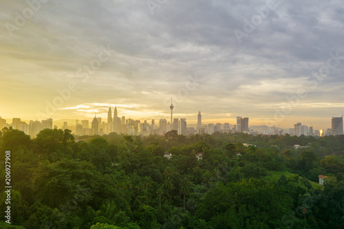 Photography Majestic sunrise over KL Tower and surrounded buildings in downtown Kuala Lumpur, Malaysia