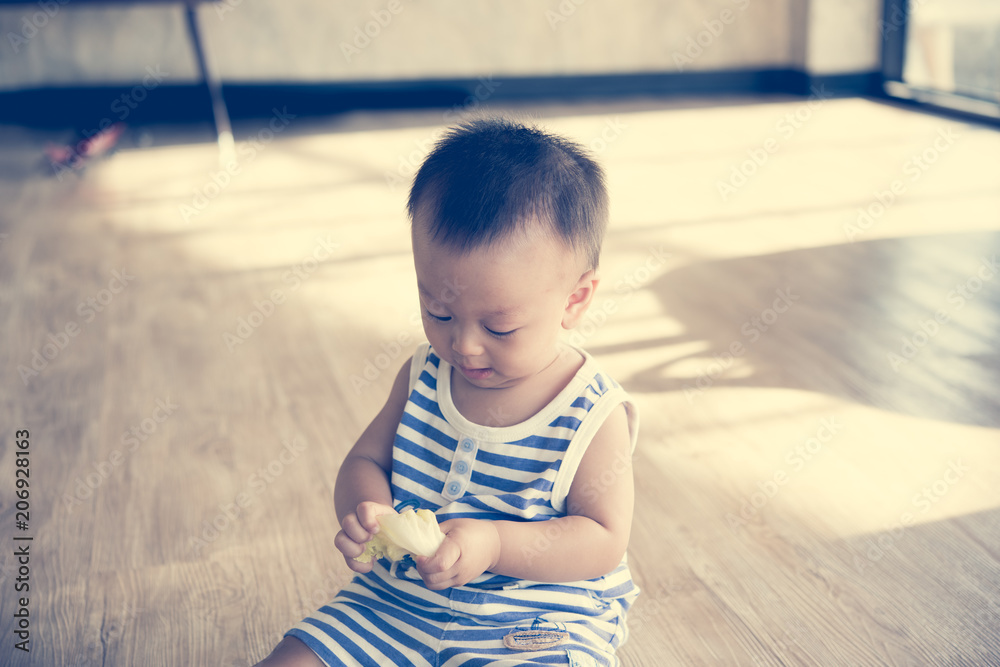 Asian cute baby boy hold the vegetables in hand. Asian cute baby boy hold the vegetables in hand.