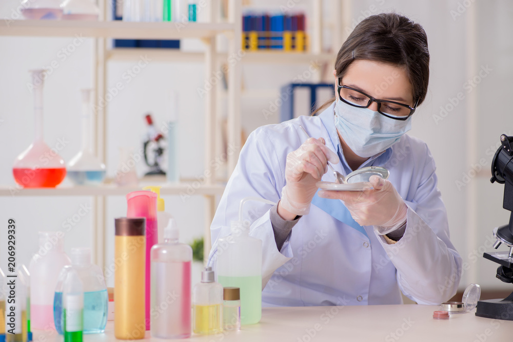 Lab chemist checking beauty and make-up products Lab chemist checking beauty and make-up products