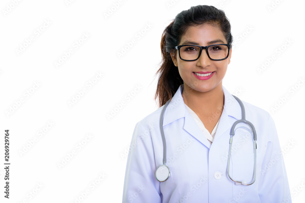 Close up of young happy Persian woman doctor smiling with eyegla Close up of young happy Persian woman doctor smiling with eyegla