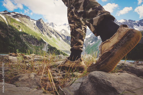 Close up on shoes on mountains trail. photo