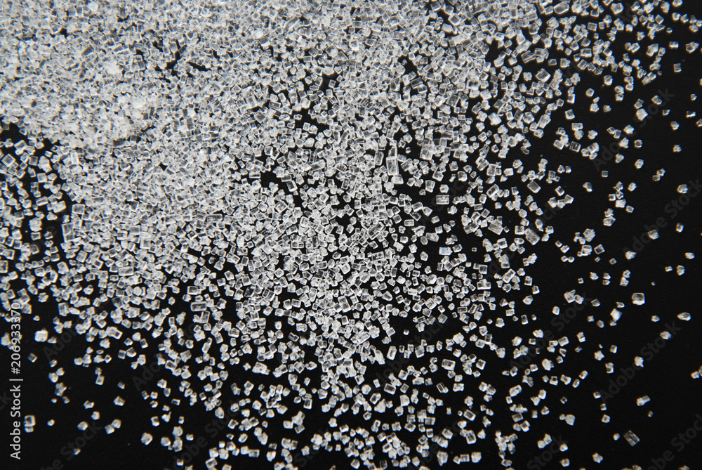 White Sweet Flour on Black Background - Free Space for text. Healthy, diet fitness concept. White Sweet Flour on Black Background - Free Space for text. Healthy, diet fitness concept.