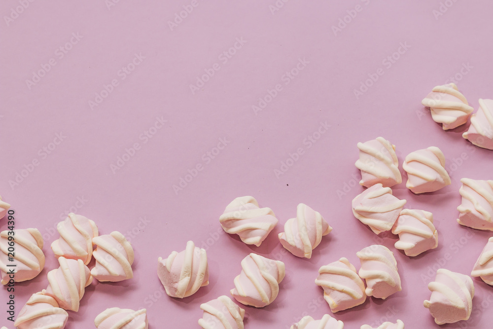 Flat lay of delicious sweet marshmallows on lilac background