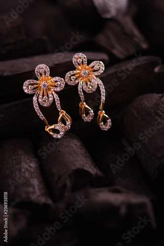 Diamond studded gold earrings.