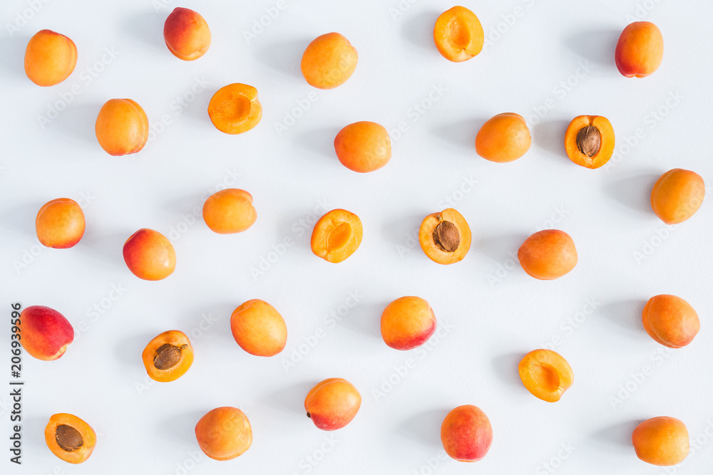 Apricots on pastel blue background. Flat lay, top view