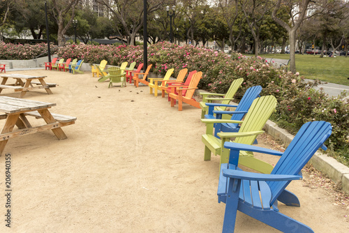 Colorful Adirondack chairs at Plaza de Cesar Chavez Park in Downtown San José, Silicon Valley, Northern California, USA. photo