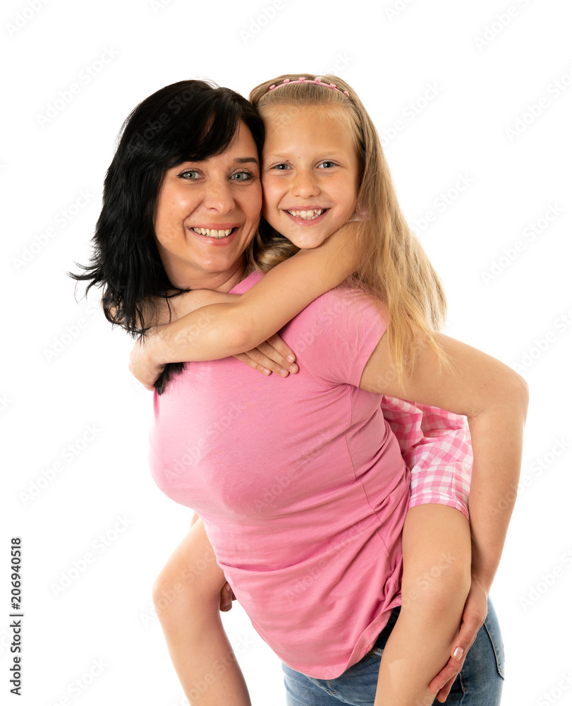 Beautiful young mother and cute charming daughter hugging and playing together. Happy loving family Beautiful young mother and cute charming daughter hugging and playing together. Happy loving family