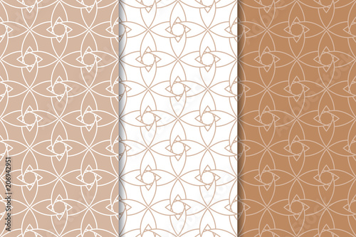 Brown and white geometric ornaments. Set of seamless patterns
