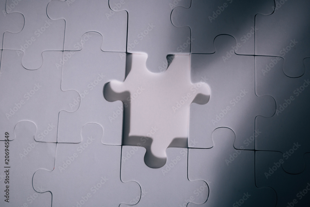 Empty and blank missing piece of jigsaw in white color background - business strategy and thinking solving problem concept. Empty and blank missing piece of jigsaw in white color background - business strategy and thinking solving problem concept.