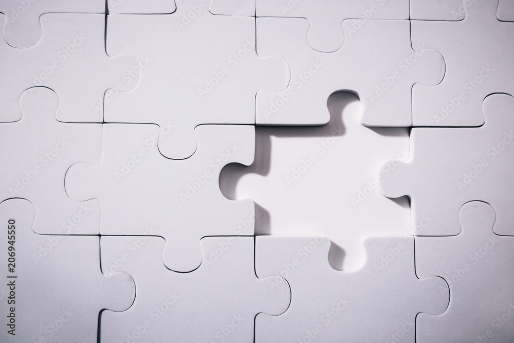 Empty and blank missing piece of jigsaw in white color background - business strategy and thinking solving problem concept. Empty and blank missing piece of jigsaw in white color background - business strategy and thinking solving problem concept.