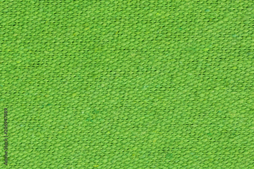 Green linen texture with visible fibers.Canvas background Green linen texture with visible fibers.Canvas background