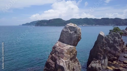 Hashiguiiwa rock formation on Wakayama coastline in Japan, Aerial pan photo