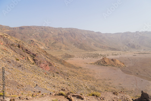 Fantastic martian landscape. Mars surface landscape with explorers in distance. View of the red terrestrial planet