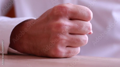 Boss fist beating on table