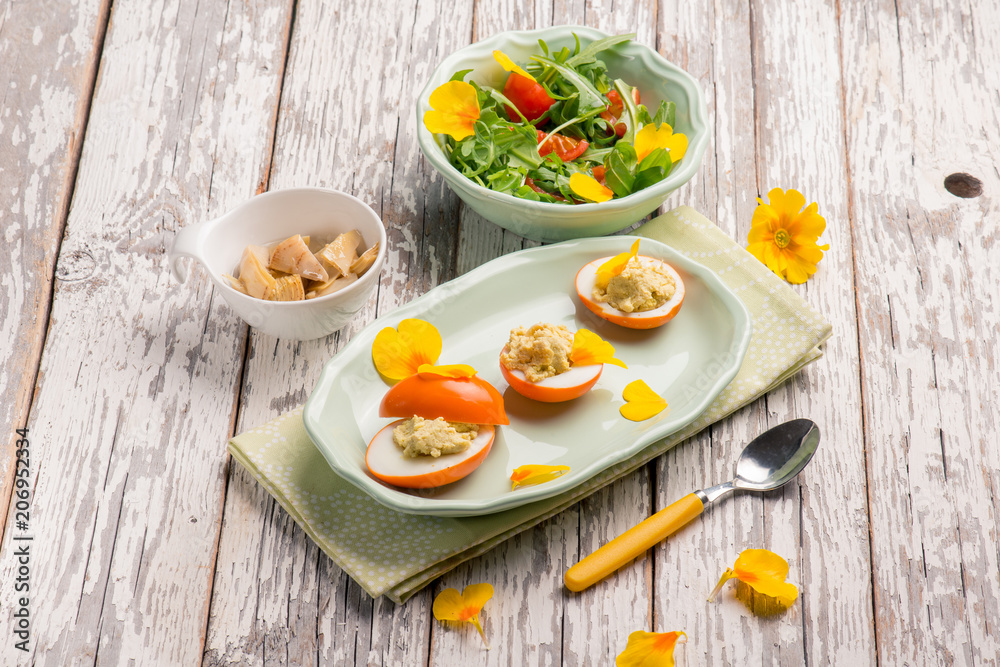 curcuma stuffed egg with mixed salad curcuma stuffed egg with mixed salad