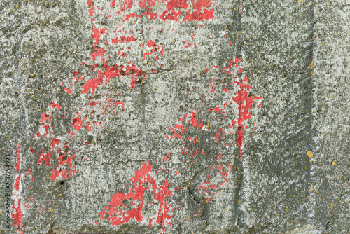 Wall fragment with scratches and cracks