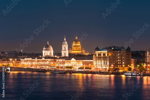 Night view of the Church of St. Catherine the Great Martyr and St. Isaac's Cathedral at the Neva River. © aapsky