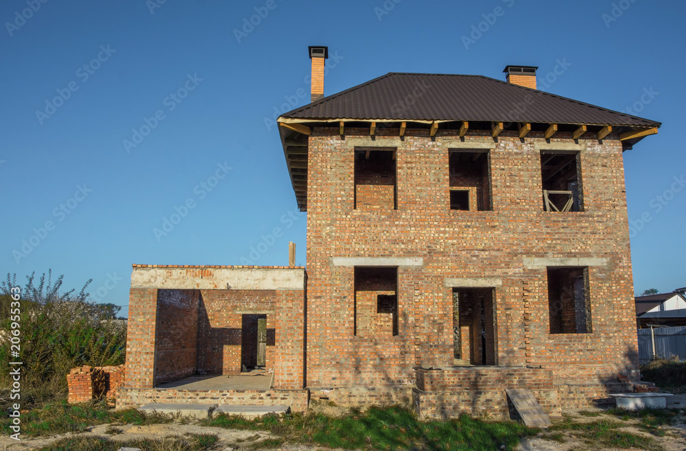 unfinished two-storey brick house