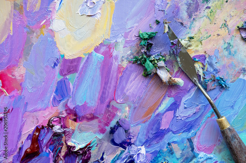 palette knot against the abstract oil paint texture on canvas, background