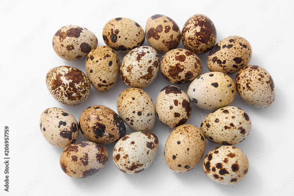 eggs quail spotted small on white background. eggs quail spotted small on white background.