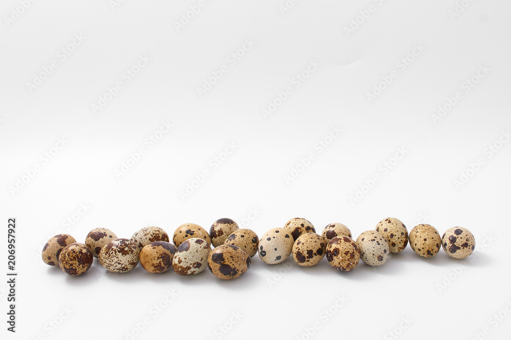 eggs quail spotted small on white background. eggs quail spotted small on white background.