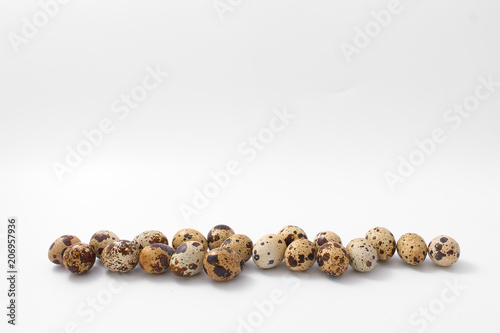 eggs quail spotted small on white background.