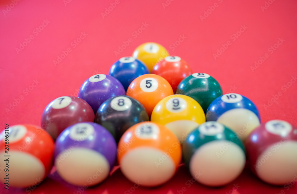 Billiard ball on red table background in pub bar room concept for sport gamble activity, game play competition. Billiard ball on red table background in pub bar room concept for sport gamble activity, game play competition.