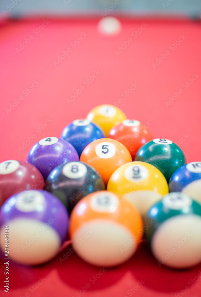 Billiard ball on red table background in pub bar room concept for sport gamble activity, game play competition. Billiard ball on red table background in pub bar room concept for sport gamble activity, game play competition.