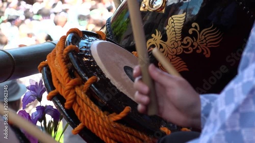 ASAKUSA, TOKYO,  JAPAN - MAY 20, 2018 : Close-up shot of beating Japanese drum at SANJA MATSURI (SANJA FESTIVAL).  In slow motion. photo